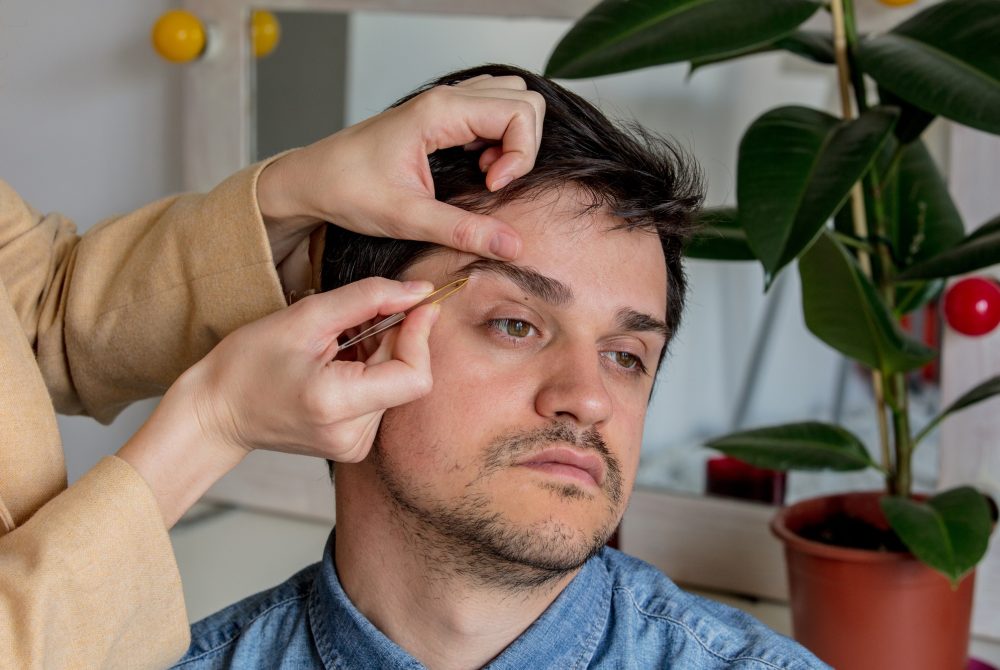 young man plucked his eyebrows